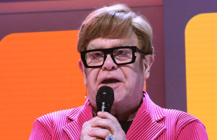 Elton John shares a message with the crowd